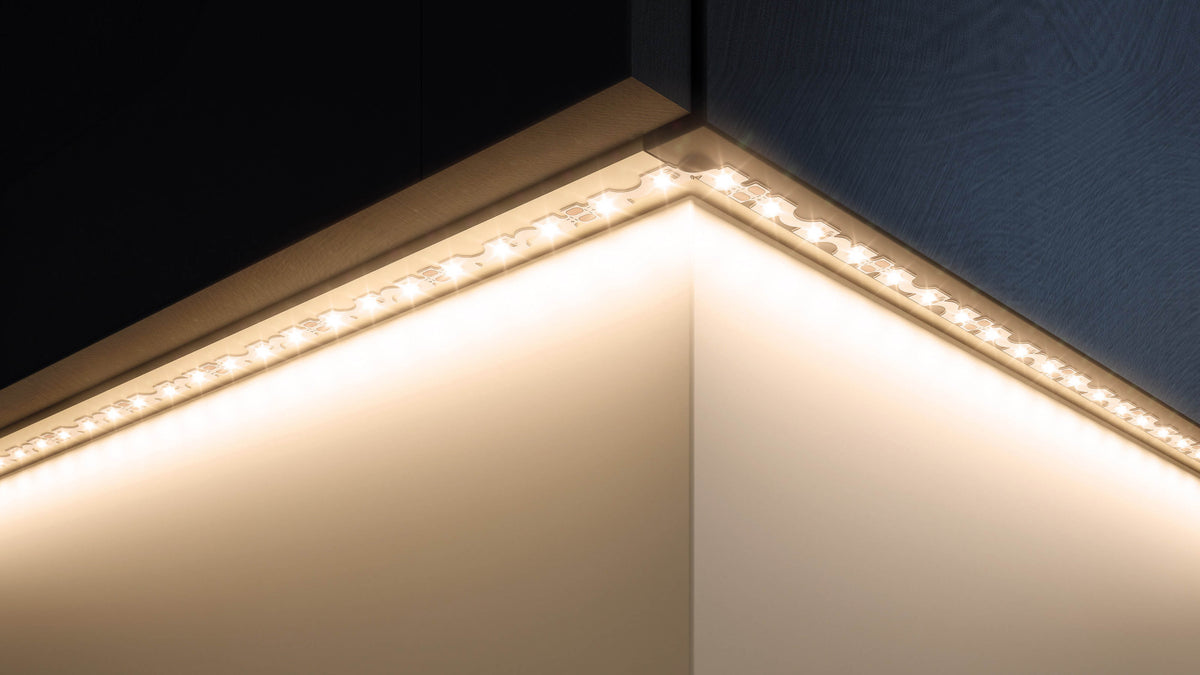 LED strip lights along a kitchen plinth