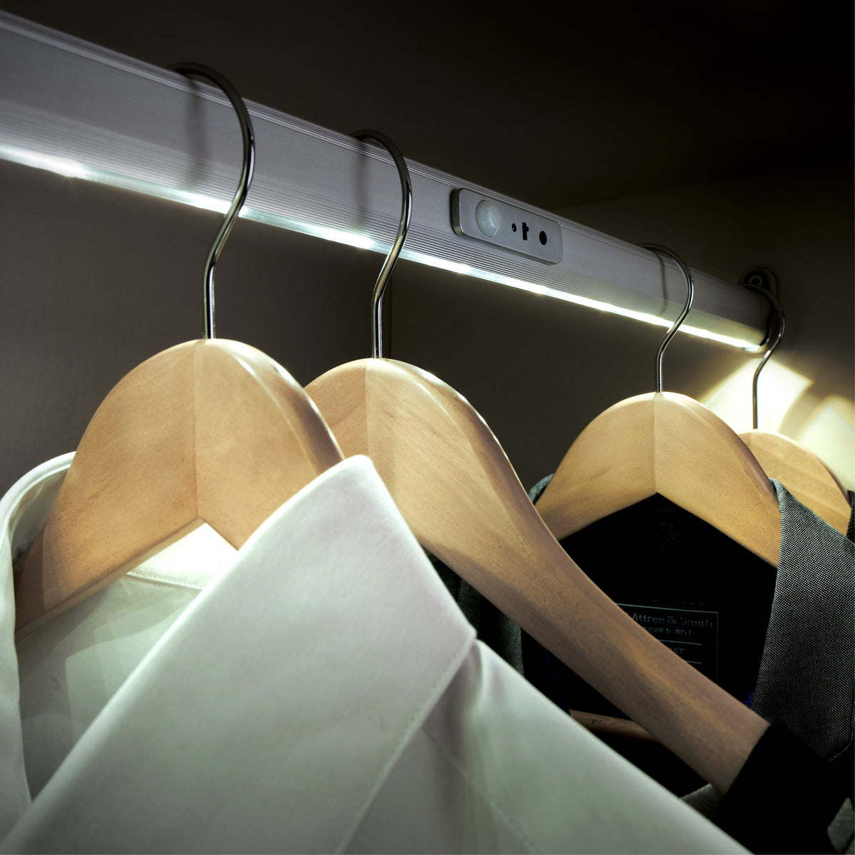 Alto lit wardrobe rail in a wardrobe