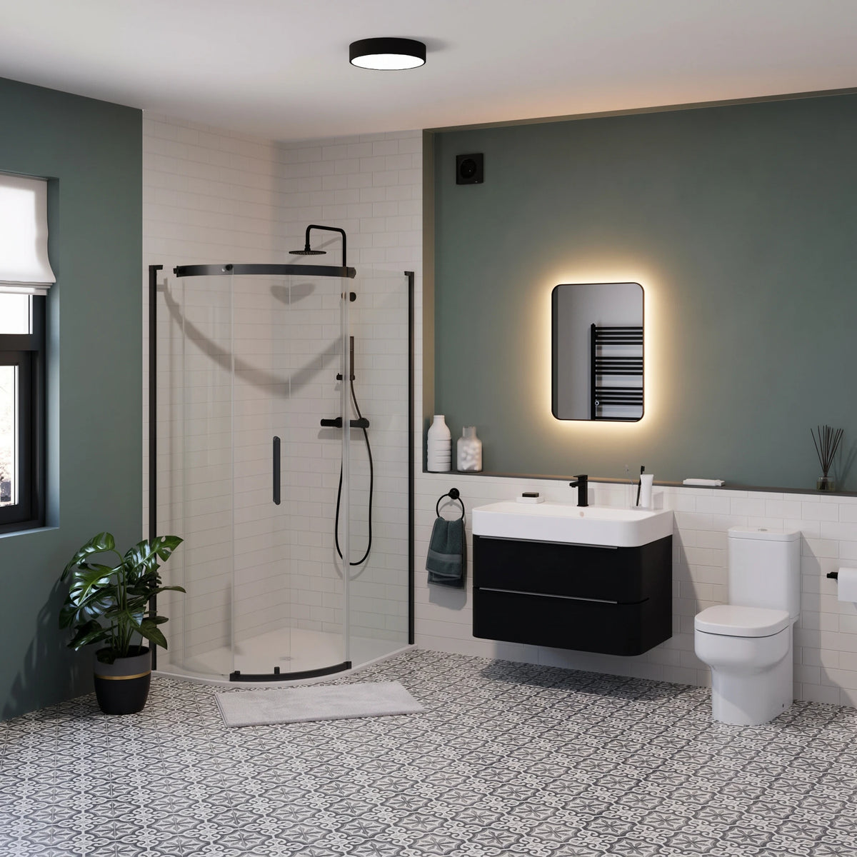 Modern bathroom interior featuring a black-framed glass shower enclosure, black floating vanity with a white sink, white toilet, patterned gray-and-white floor, and a green accent wall with an illuminated mirror. #Finish_Black